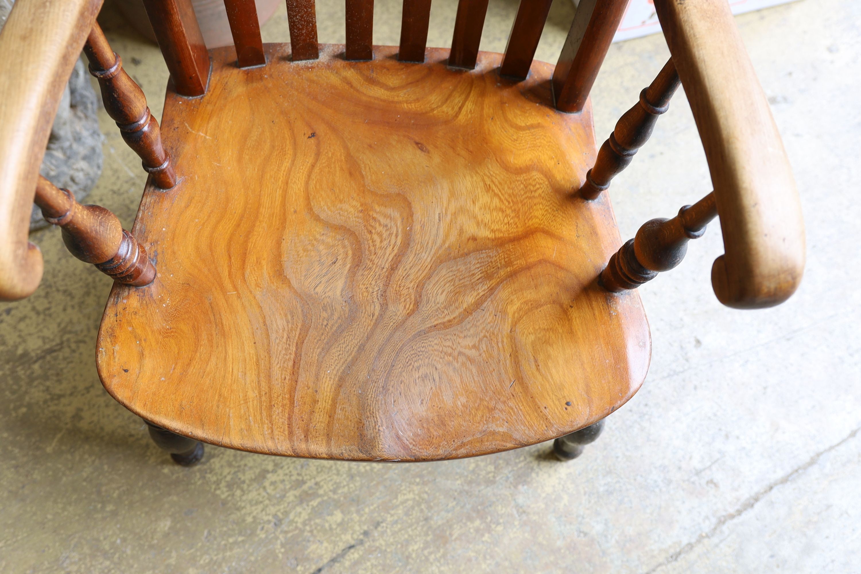 A Victorian elm and beech Windsor lathe back armchair.